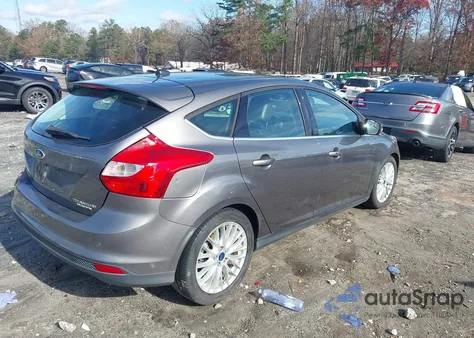 2014 Ford Focus Titanium z USA, uszkodzony, nr VIN 1FADP3N27EL297885